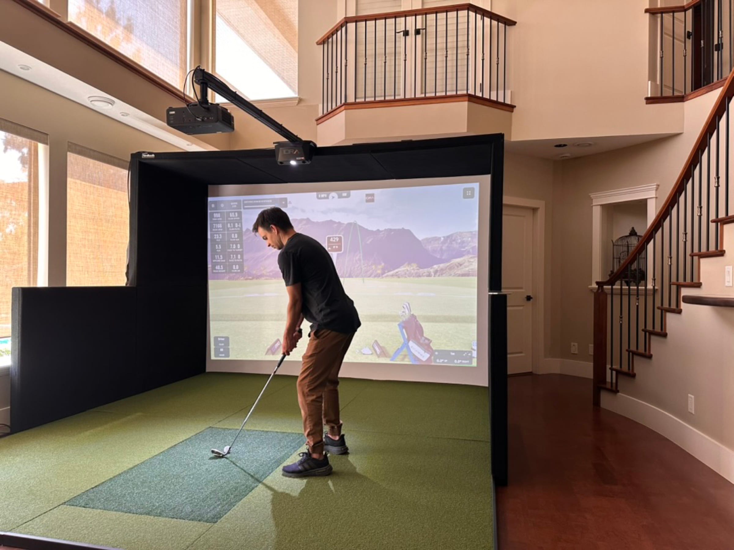 Wide view of a lounge-style install with adjacent bar and dining area